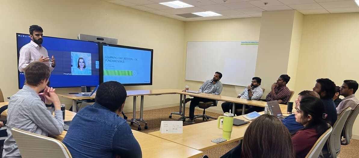 Krishna Peri leading a UX fundamentals workshop for a room of colleagues